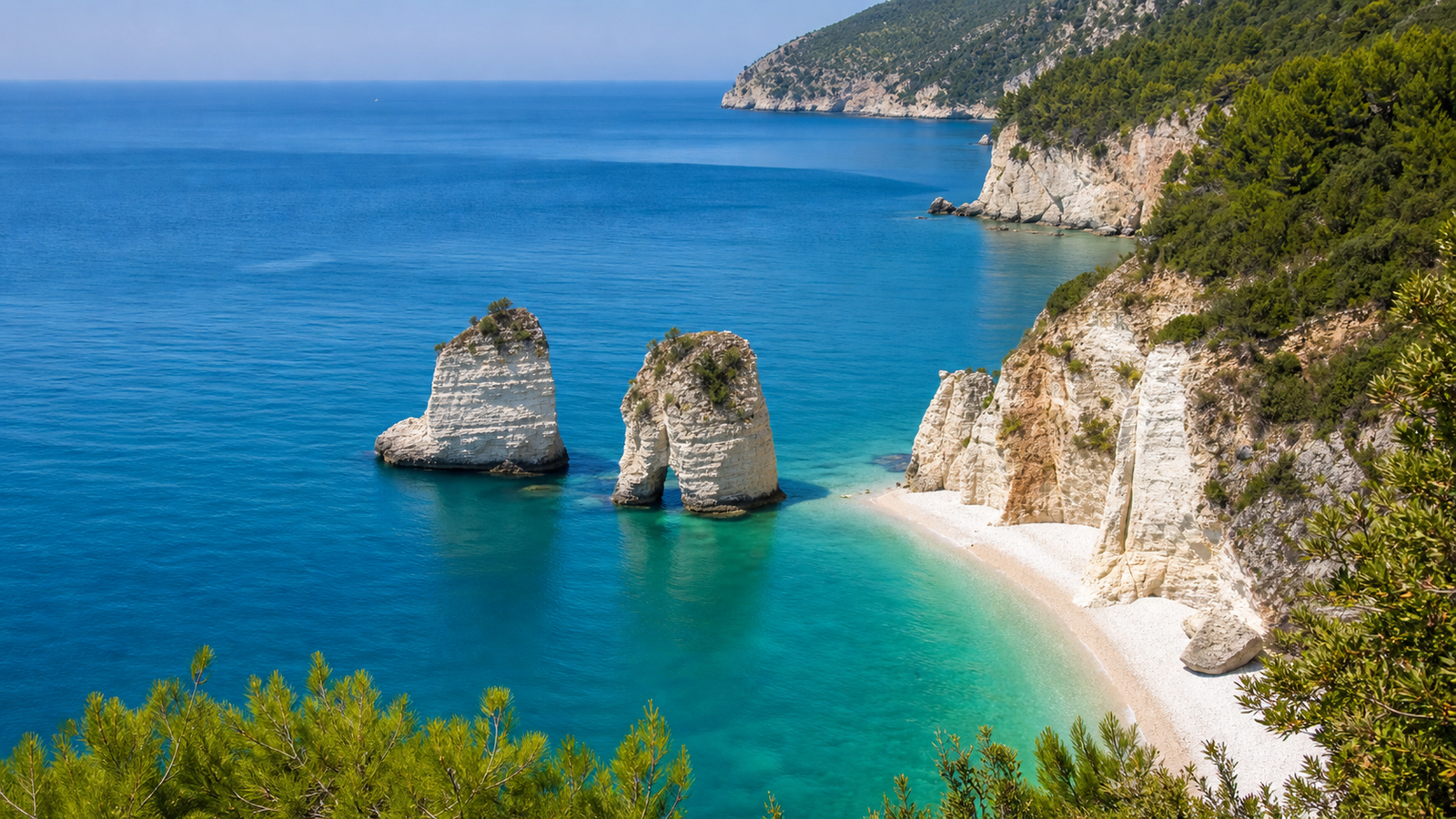 Baia delle Zagare sea stacks above clear Adriatic water on the Gargano coast in Puglia.
